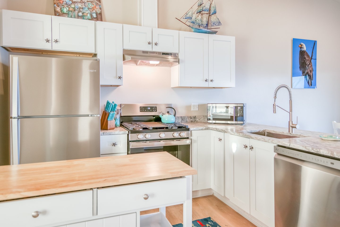 Beautiful stainless steel appliances with gas range.