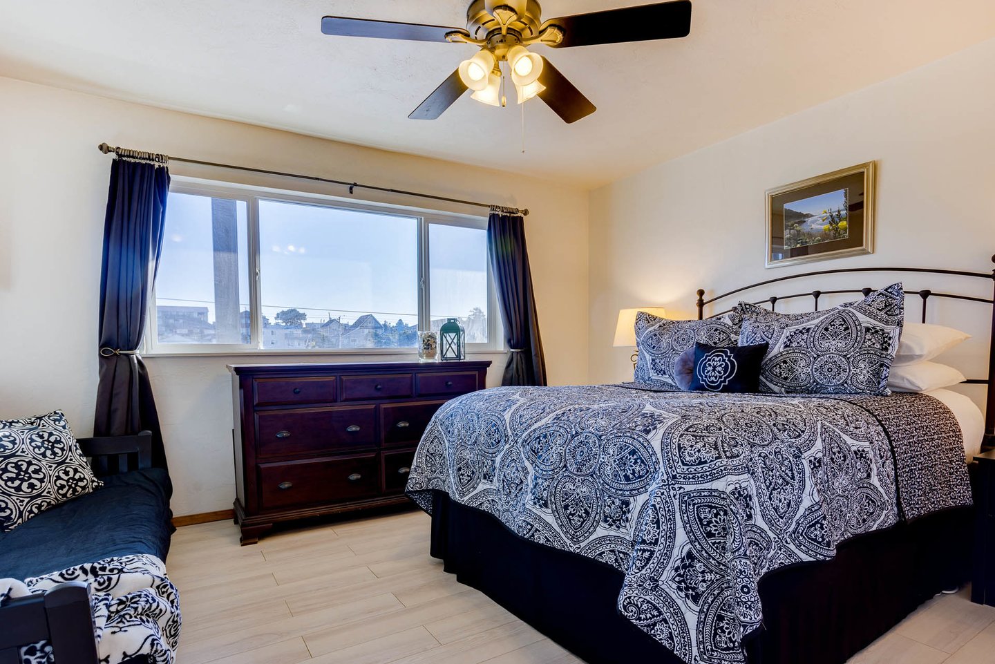 Spacious bedroom with king bed.