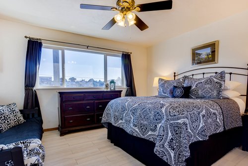 Spacious bedroom with king bed.
