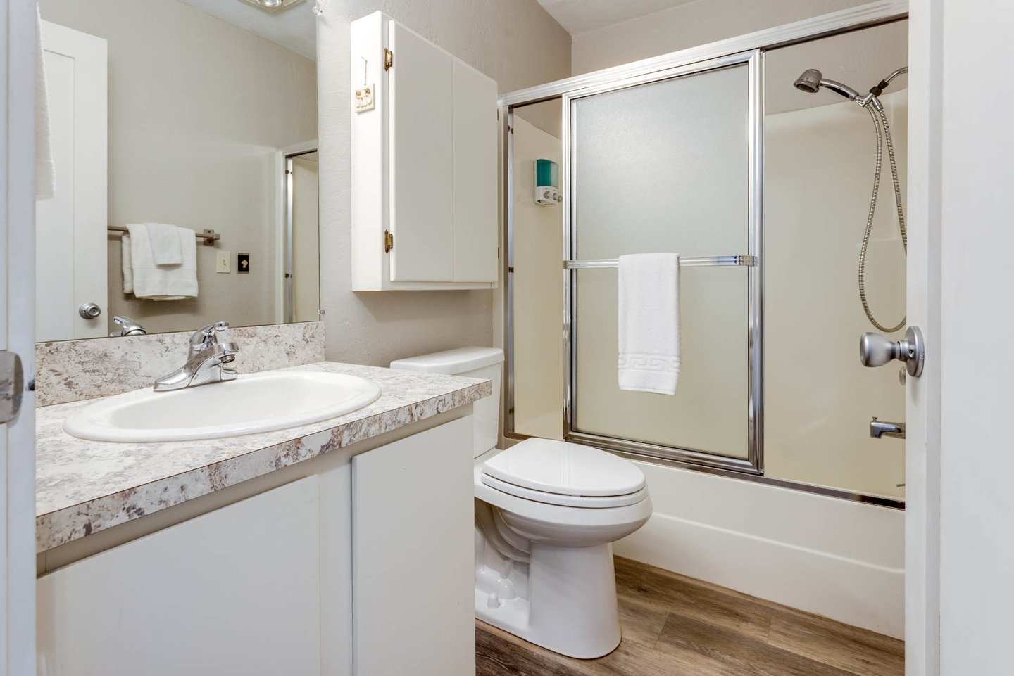 The ensuite bath has a tub/shower combo.