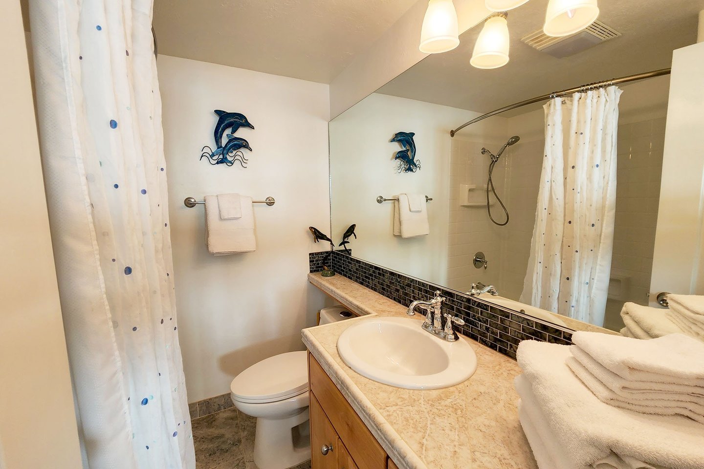 Full bath with tub/shower combo.