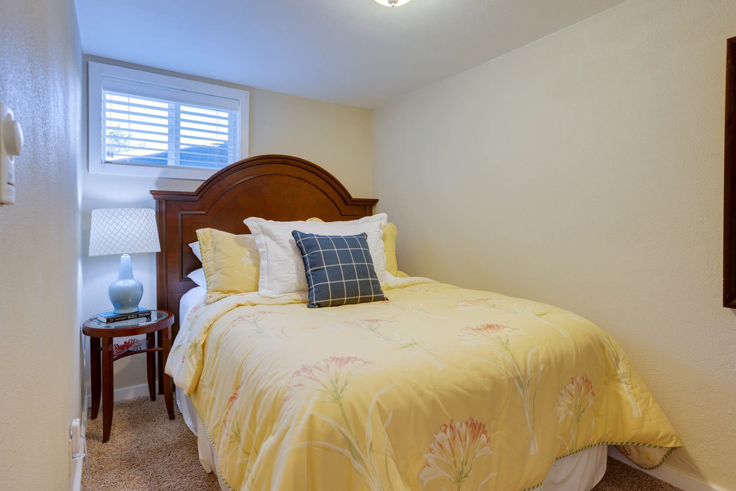 The second bedroom has a cozy queen bed.