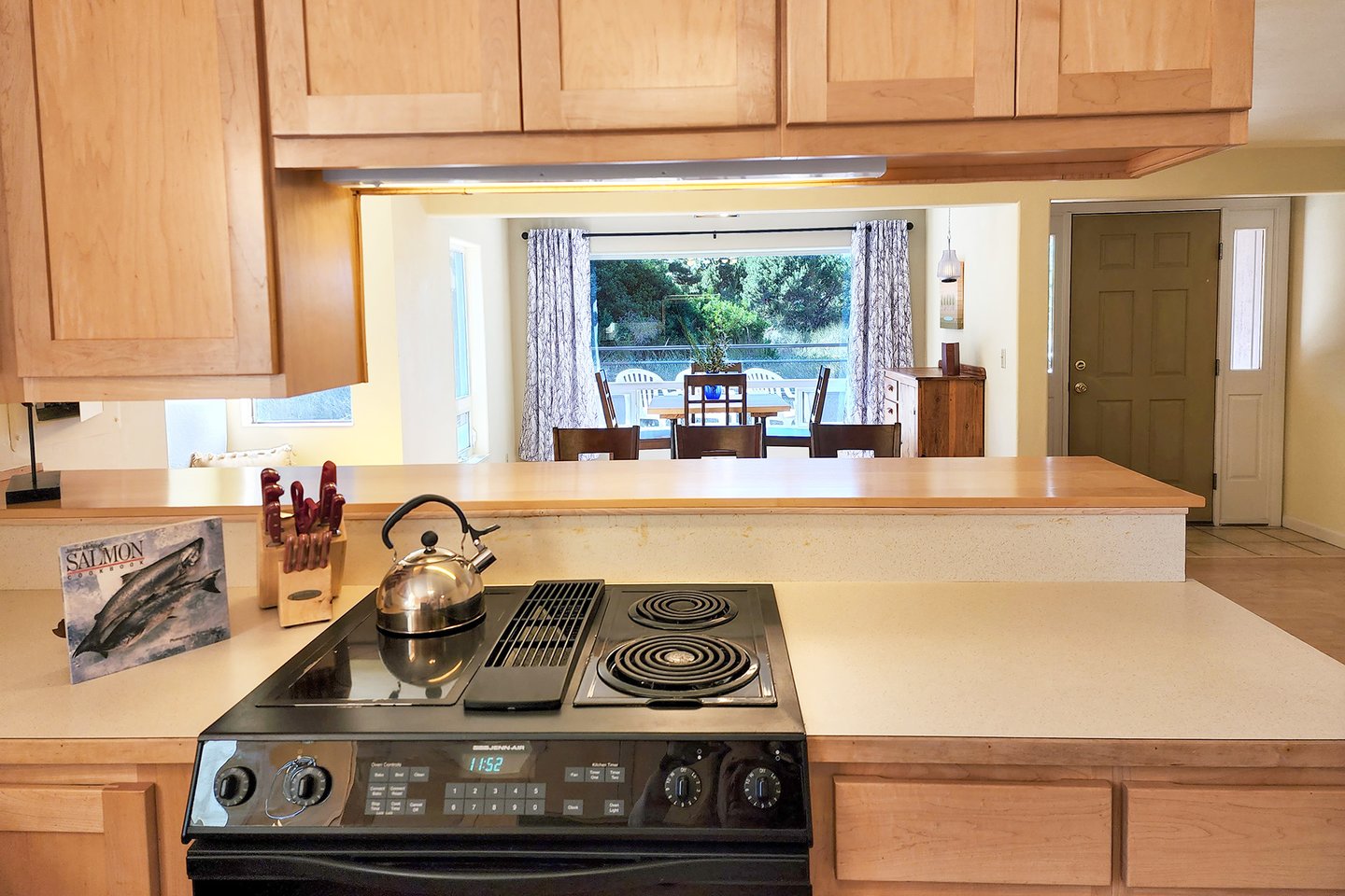 The pass through kitchen to table is convenient for the cook.