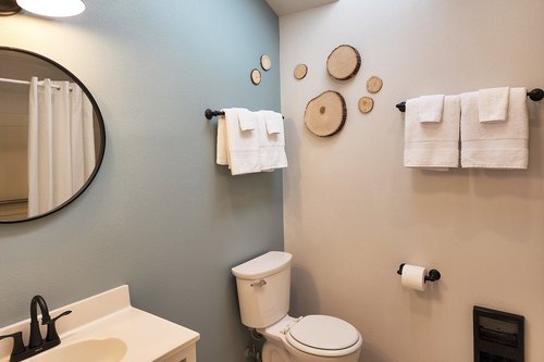 Bath in hallway with tub/shower.