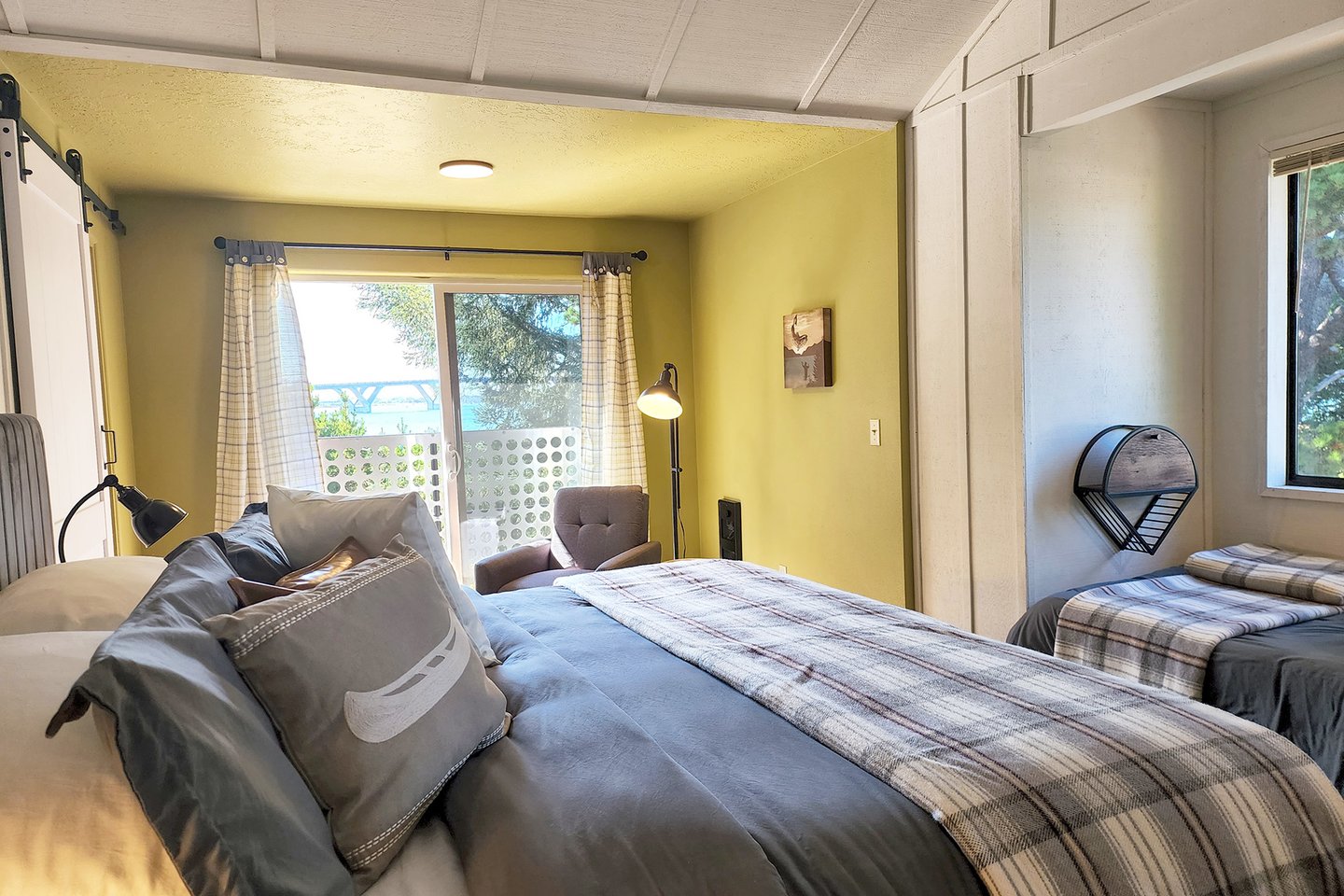 The king bed is comfortable in this large upstairs bedroom.