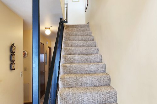 Upstairs to the master ensuite bed and bath.