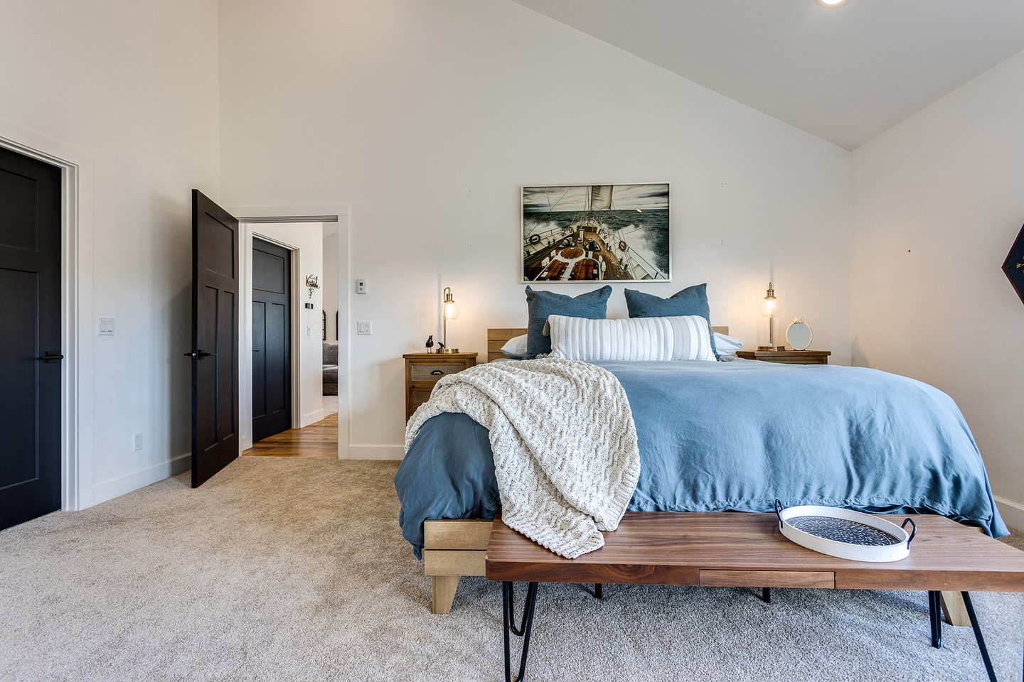 The spacious primary bedroom has a king bed for comfort.