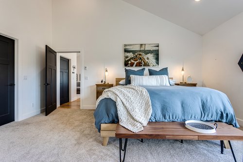 The spacious primary bedroom has a king bed for comfort.