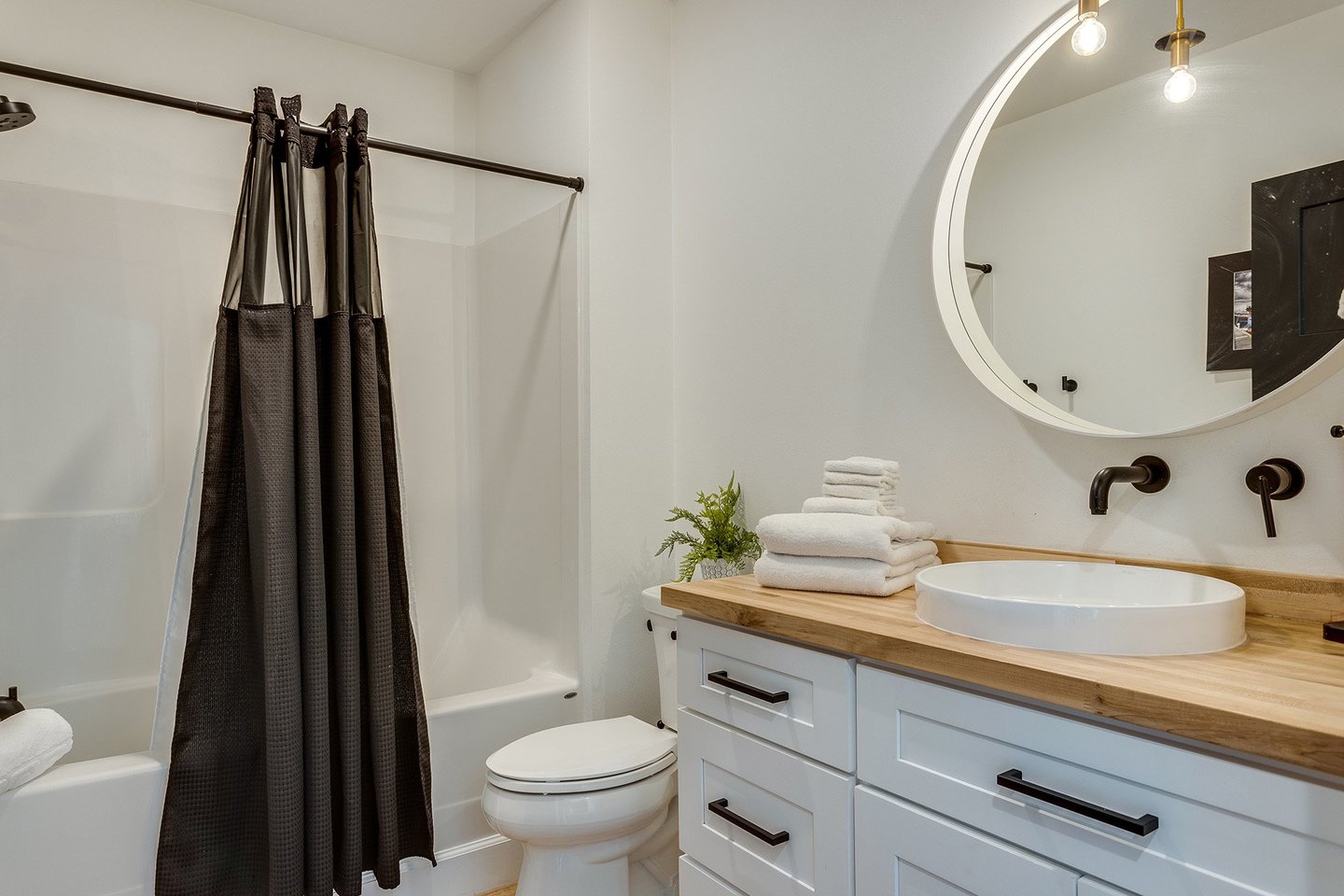 Tub/Shower combo and vessel sink.