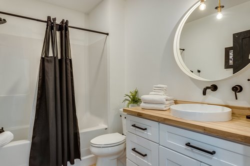 Tub/Shower combo and vessel sink.