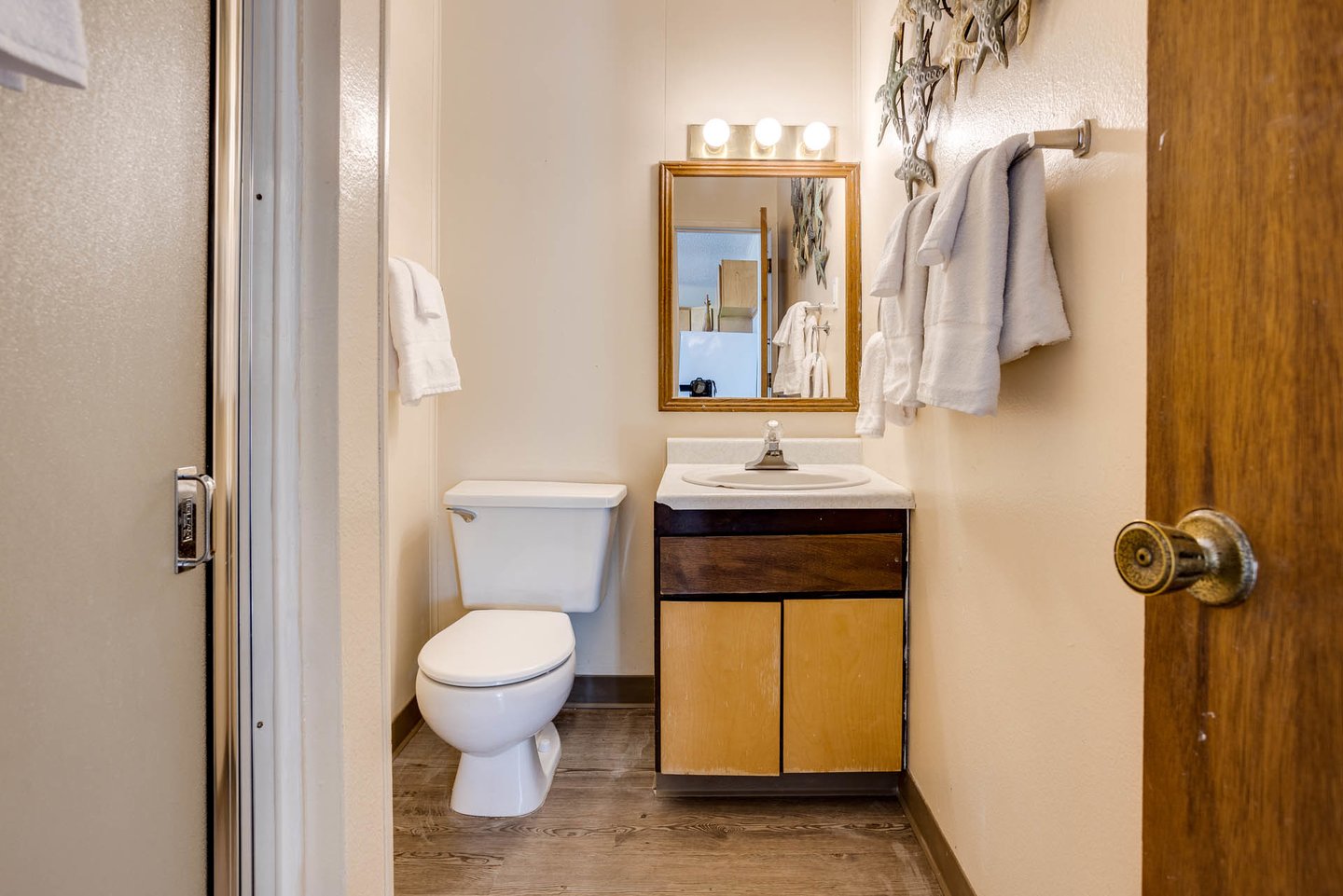Bath in the hallway with a shower.