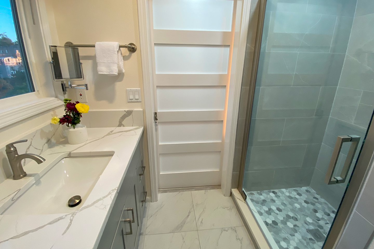 Bath in the hallway on the main floor has beautiful finishing touches.