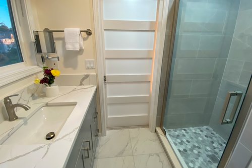 Bath in the hallway on the main floor has beautiful finishing touches.
