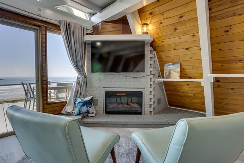 Cozy up to a warm fireplace and watch the ocean.