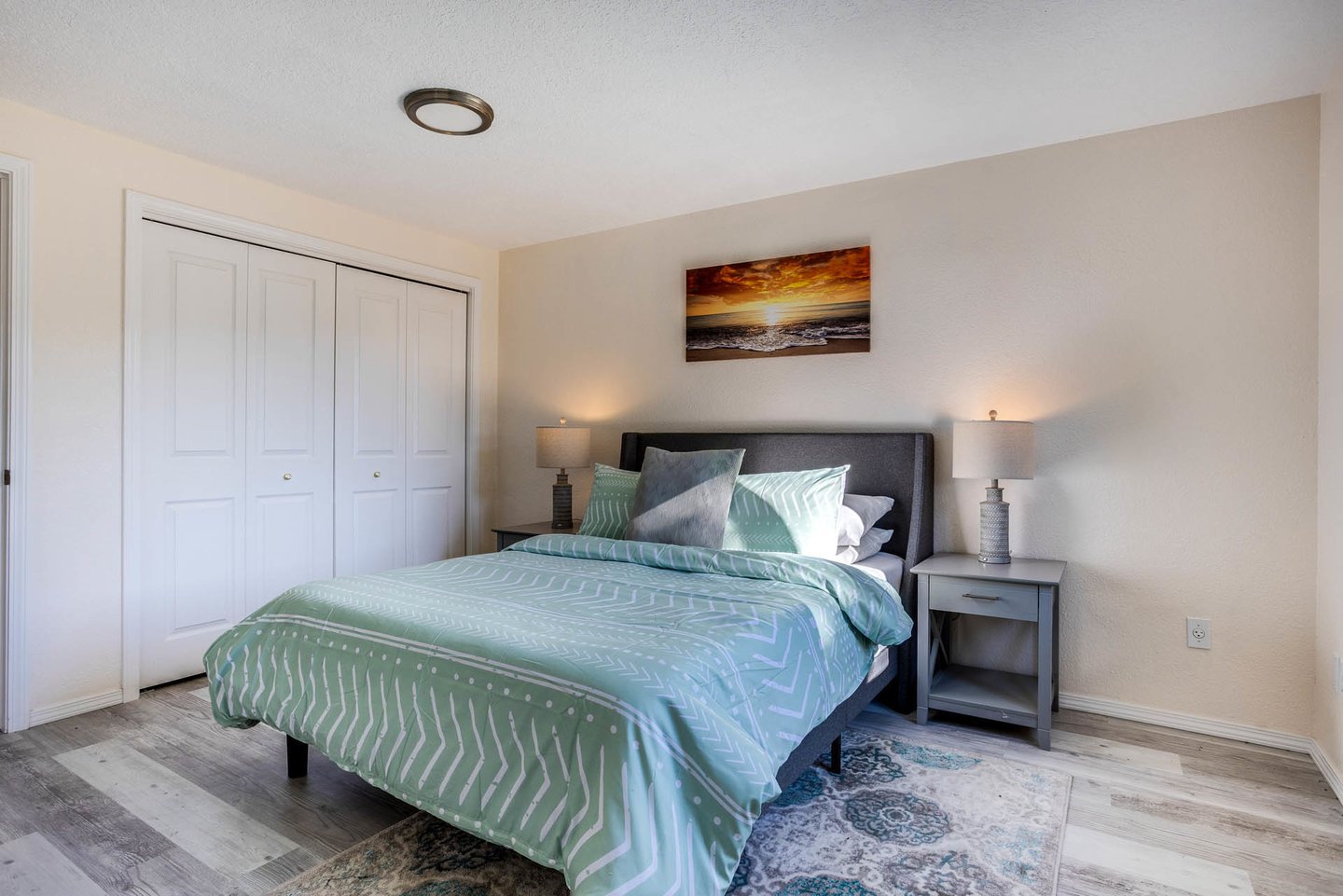 Relax in the downstairs bedroom with a queen bed