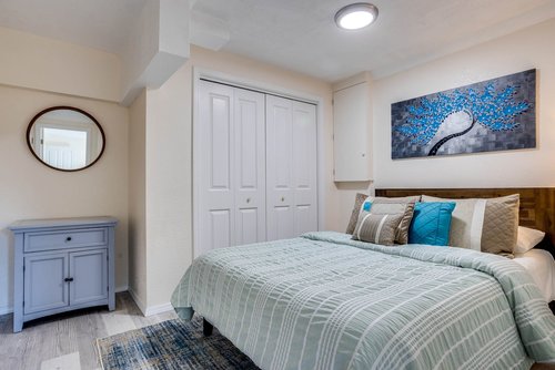 Cozy up in the downstairs bedroom with a queen bed.