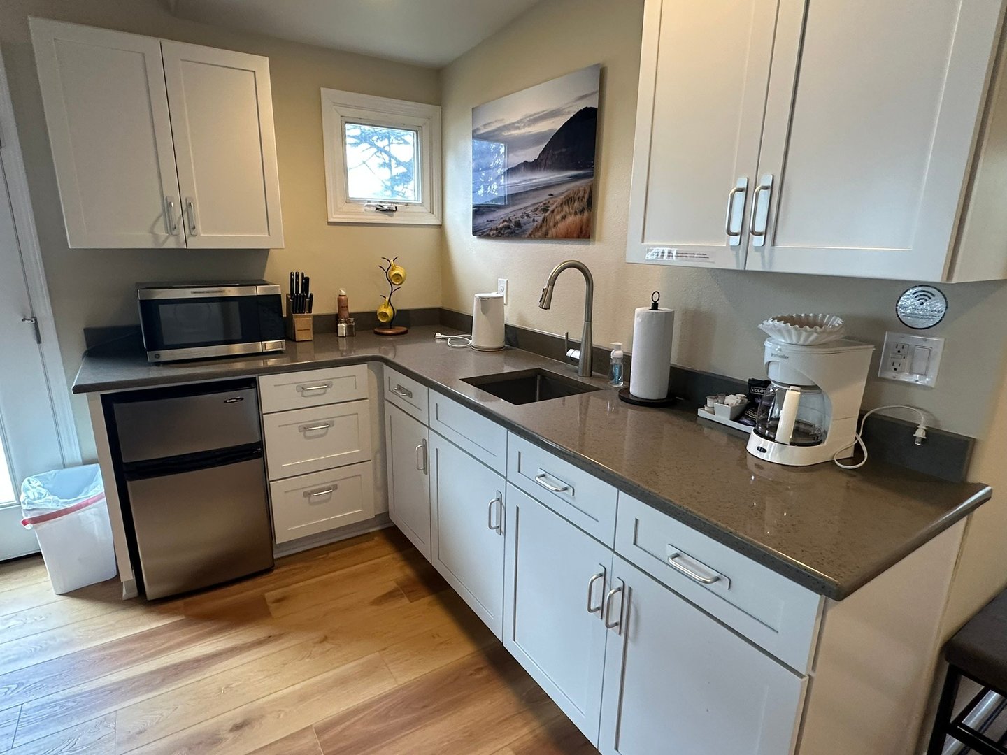 Kitchenette is equipped with enough for a tasty meal.