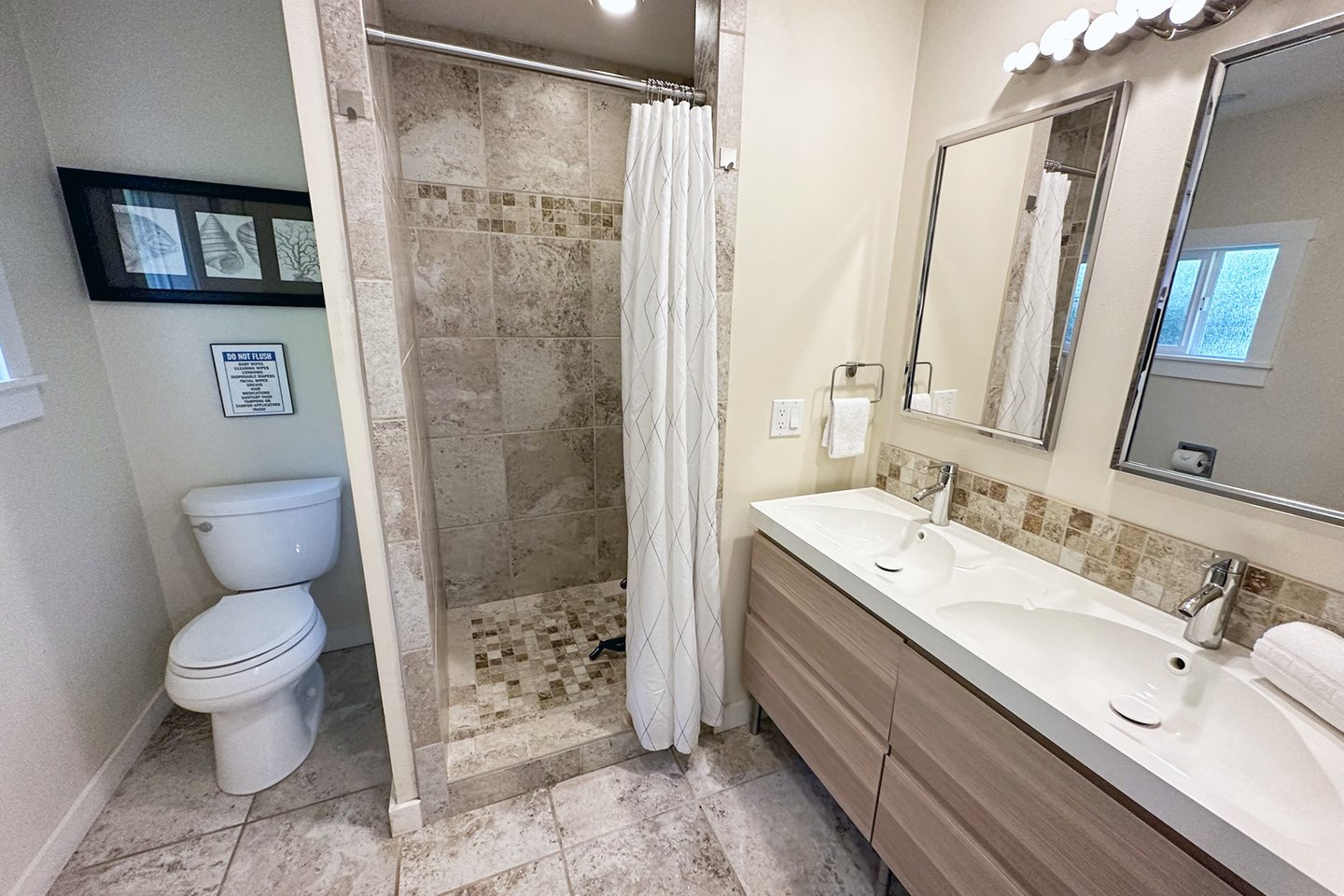 Walk in tiled shower.