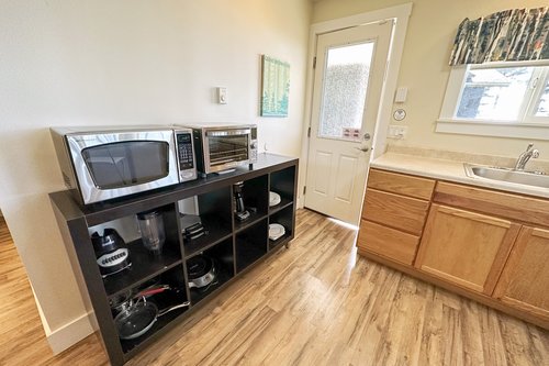 Kitchenette is equipped with enough for a tasty meal.