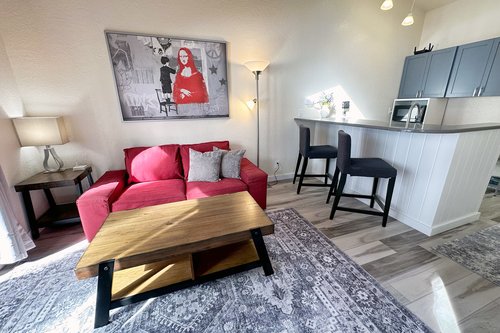 Relax on the sofa or at the kitchen bar.
