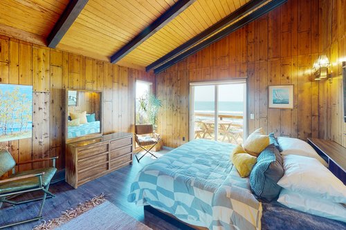 Second bedroom with an ensuite bath and king bed.