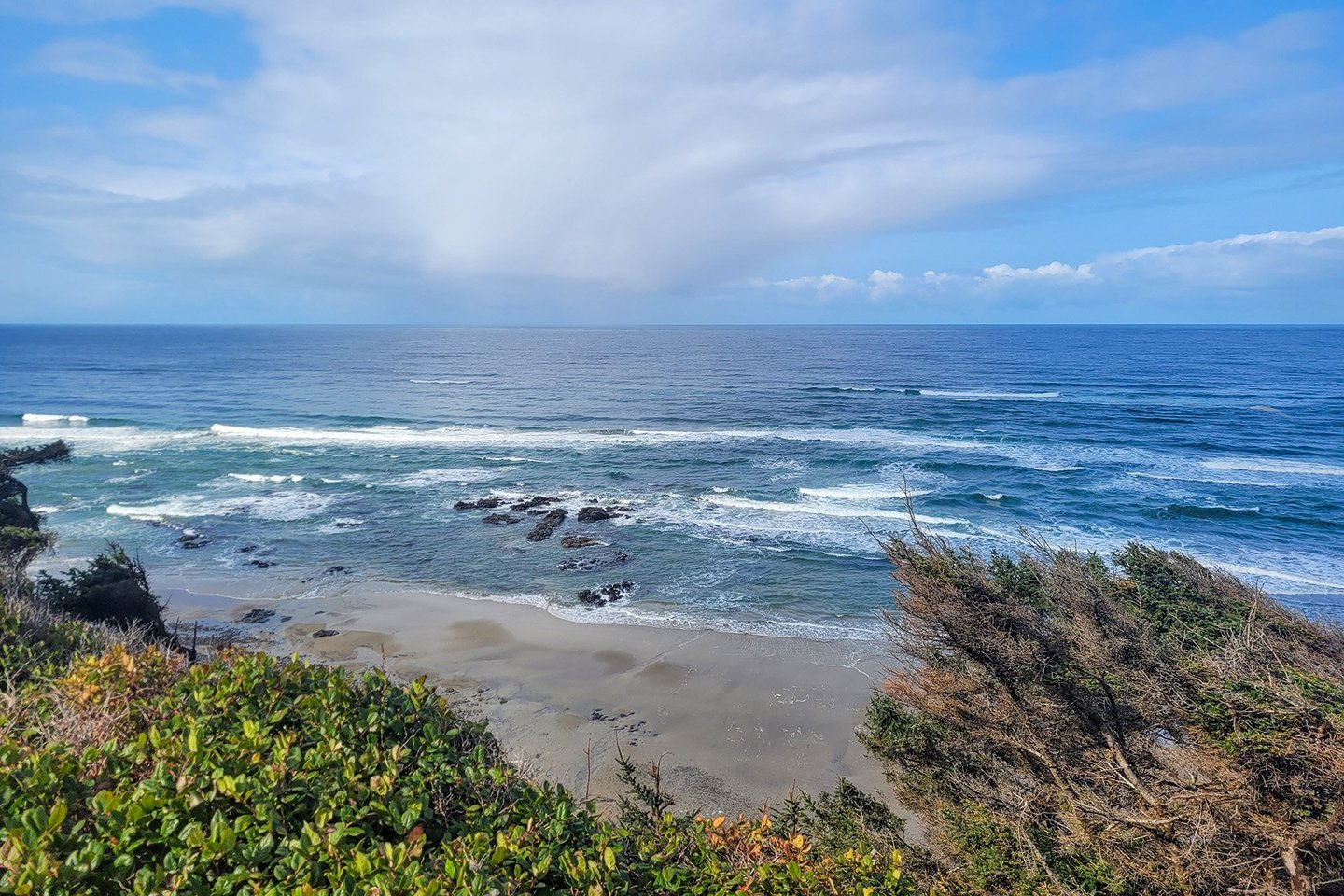 Watch a rain cloud out over the ocean.