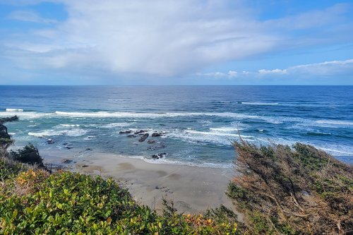 Watch a rain cloud out over the ocean.