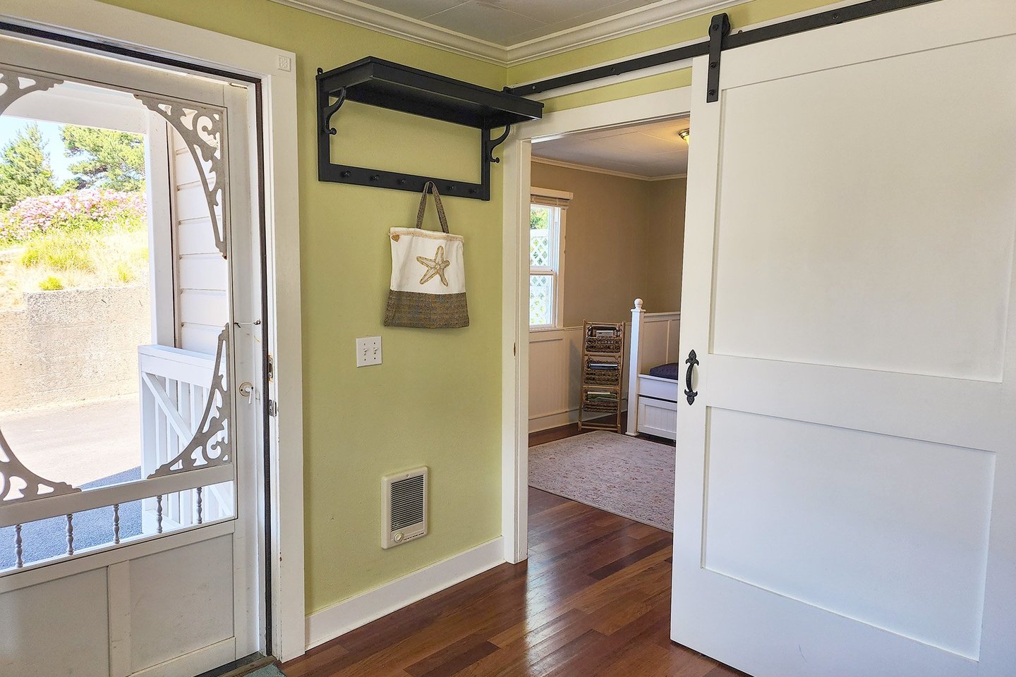 The barndoor hides another guest room for tv or sleeping!
