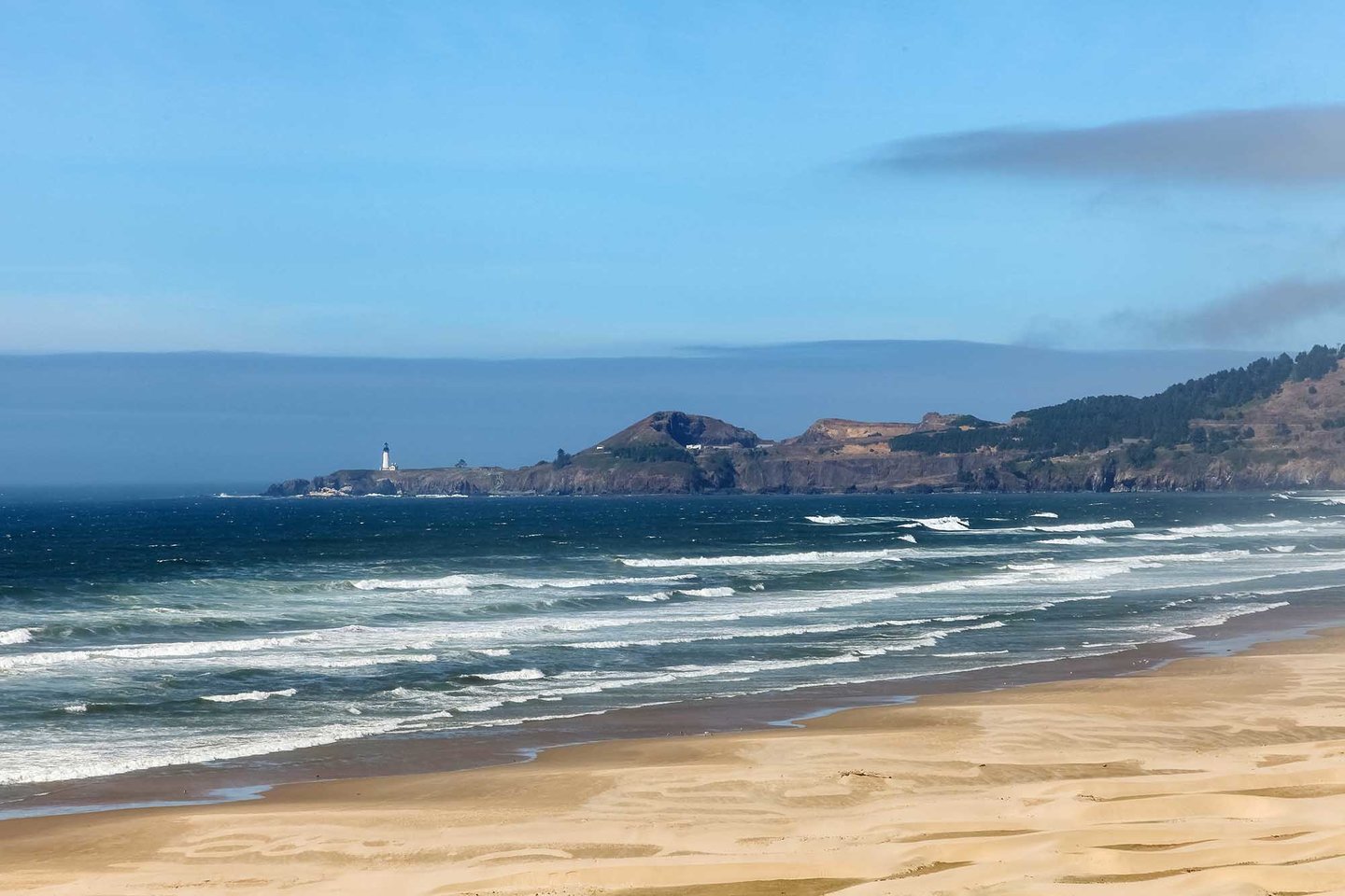 Enjoy walking on the beach at Nye Beach and the view of the lighthouse.