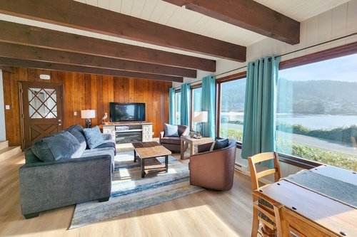The living room has plenty of seating for everyone to gather.
