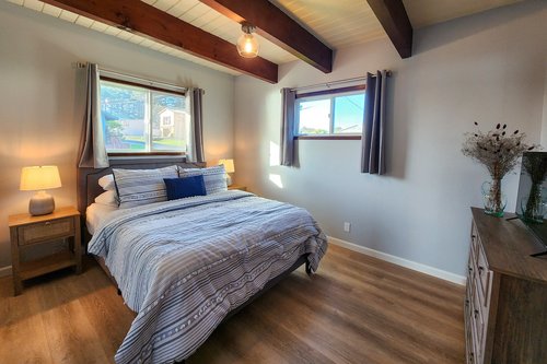 Cozy up in the first of three bedrooms downstairs. Queen bed!