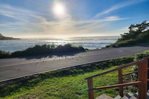 Watch the waves roll into the Yachats River bay.