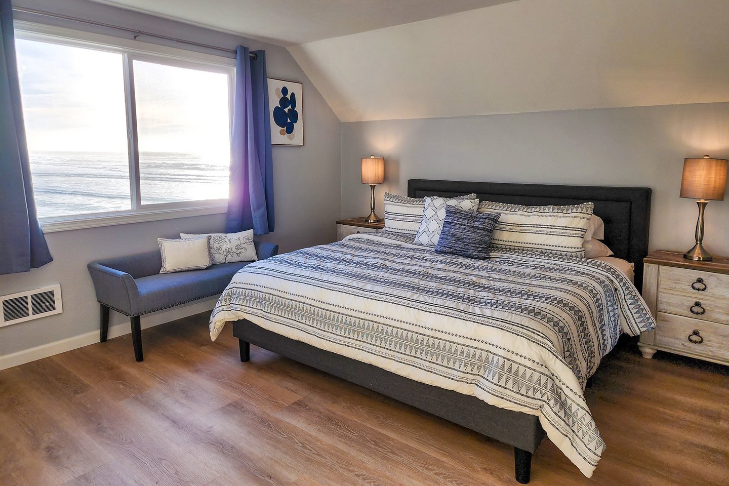 Primary bedroom upstairs with King bed and ocean views!