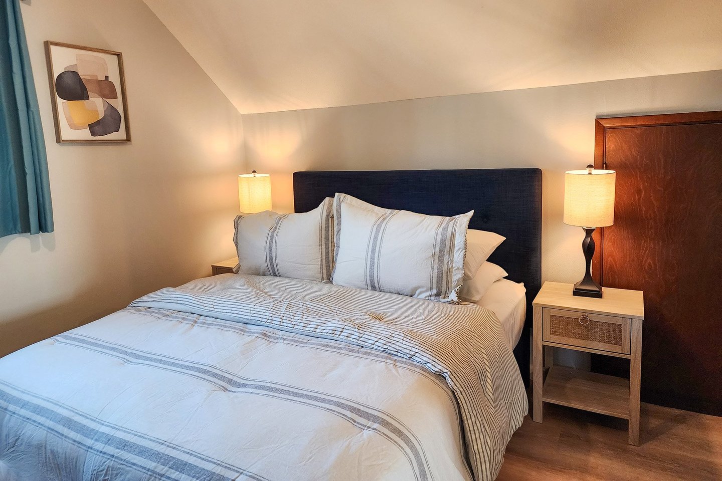 Second bedroom upstairs with queen bed.