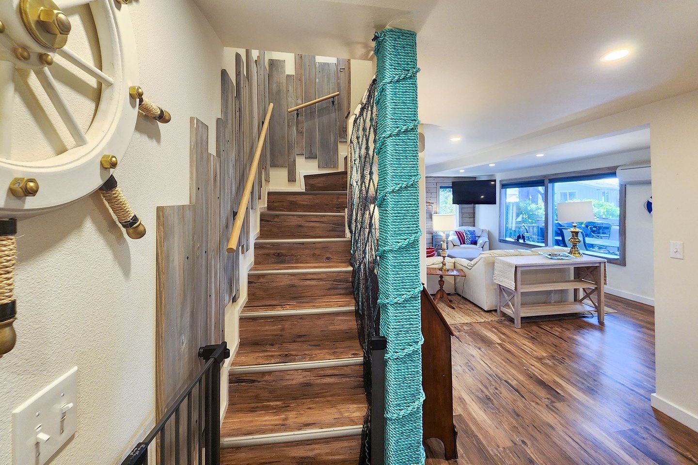 Upstairs leads to three more bedrooms.