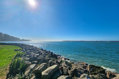 Look out toward the ocean and watch the fishing boats.