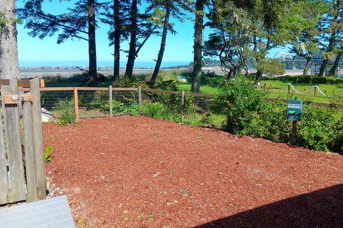 There's an area with a view of the Alsea Bay just for your pups to play.