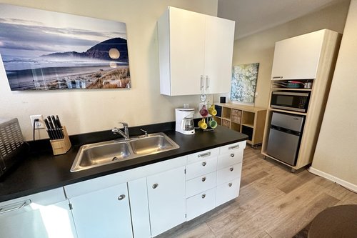 Kitchenette is equipped with enough for a tasty meal.