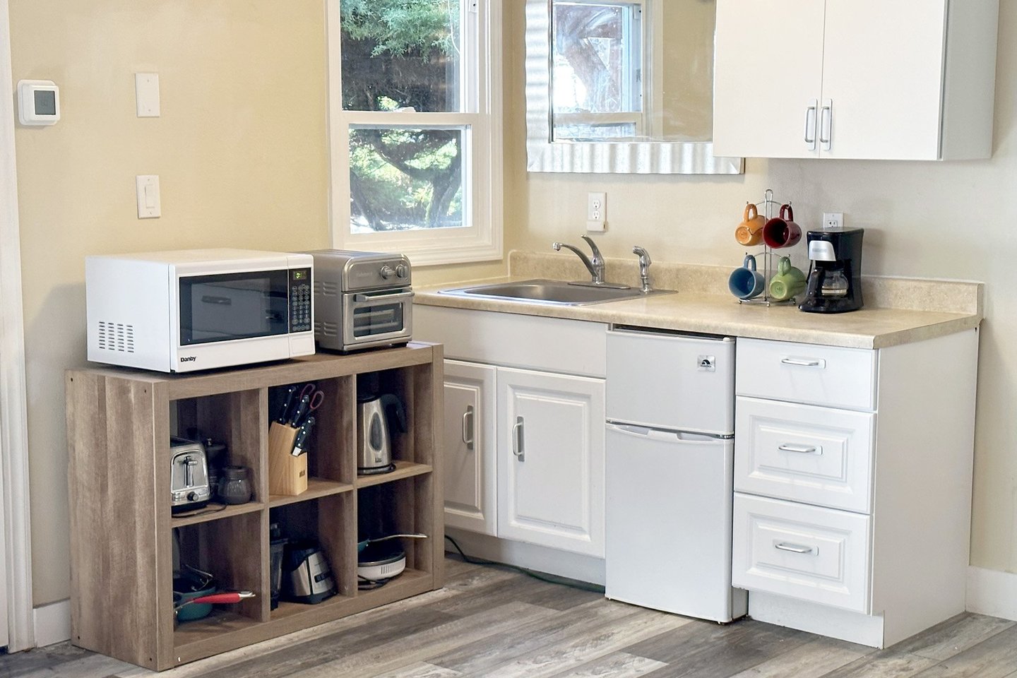Kitchenette is equipped with enough for a tasty meal.