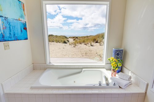 The ensuite bath boasts a jetted tub with a view.