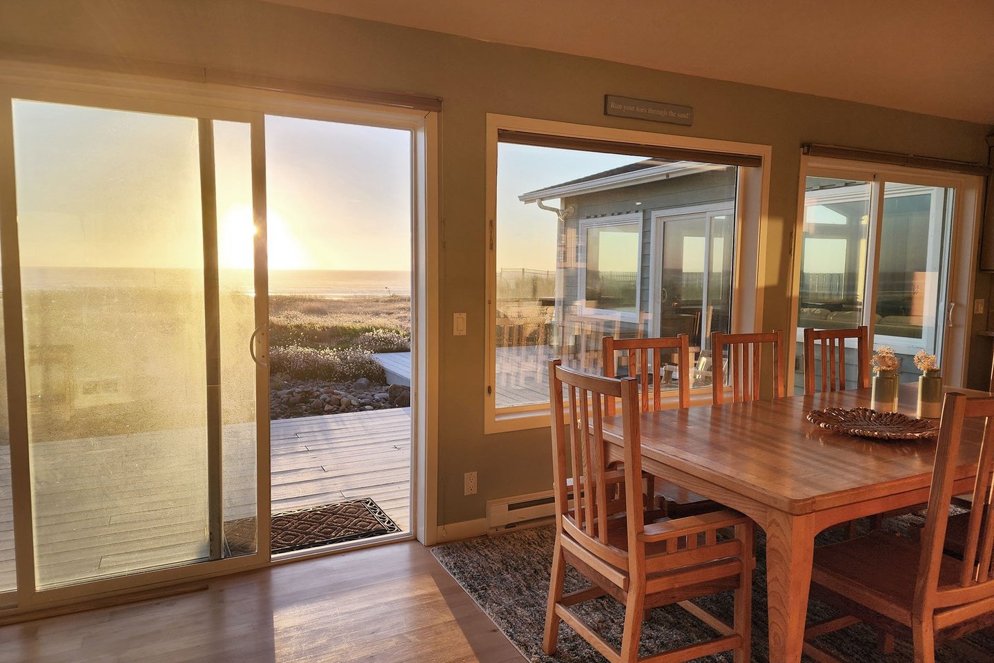 Watch the sun sink into the Pacific as you play a board game at the table.