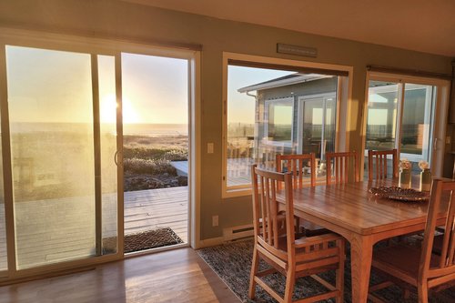 Watch the sun sink into the Pacific as you play a board game at the table.