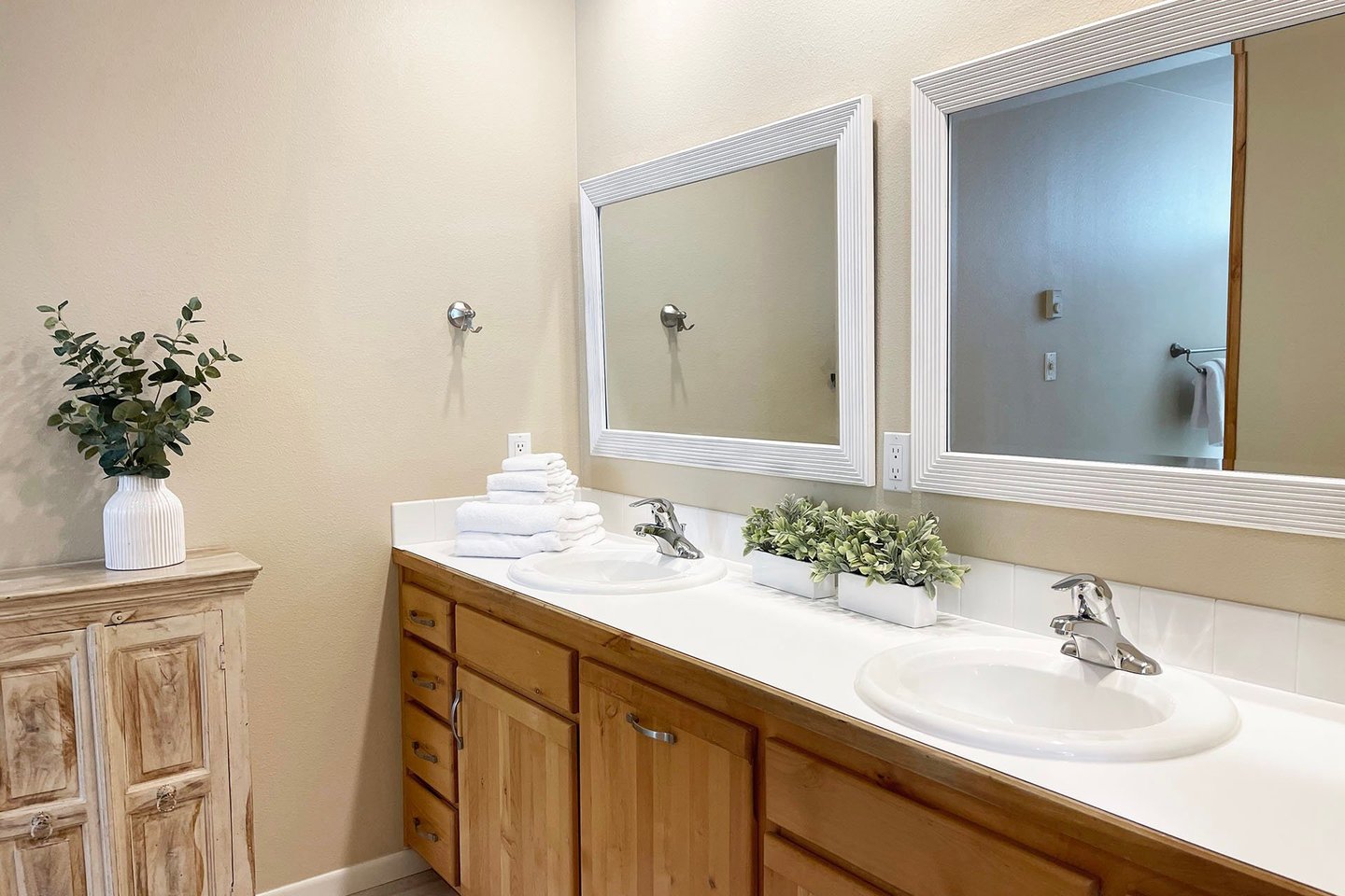The primary ensuite has a double sink vanity.