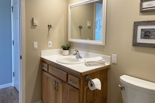 The second bathroom opens up to the bedroom or the kitchen.