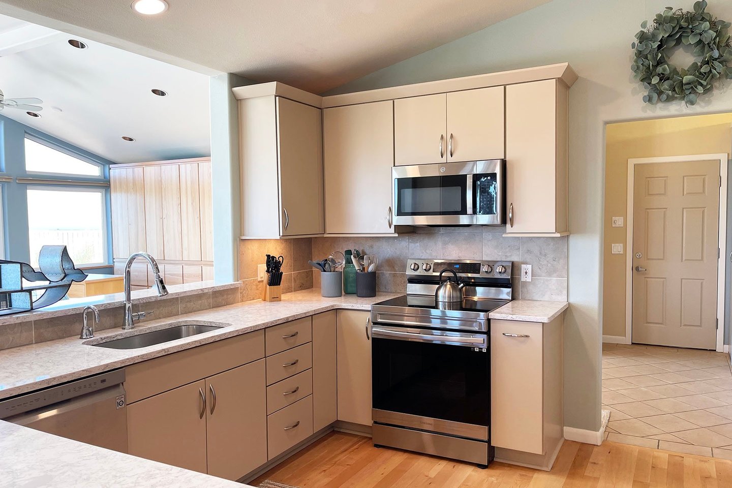 Fabulous glass top range and stainless appliances.