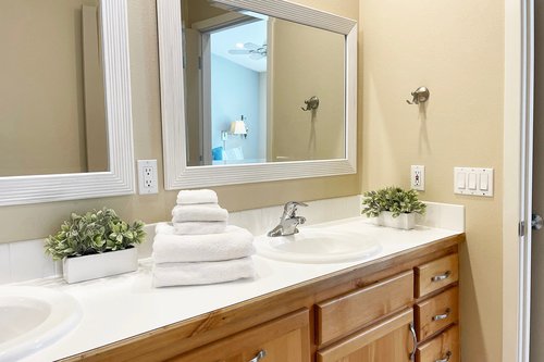 The primary ensuite has a double sink vanity.