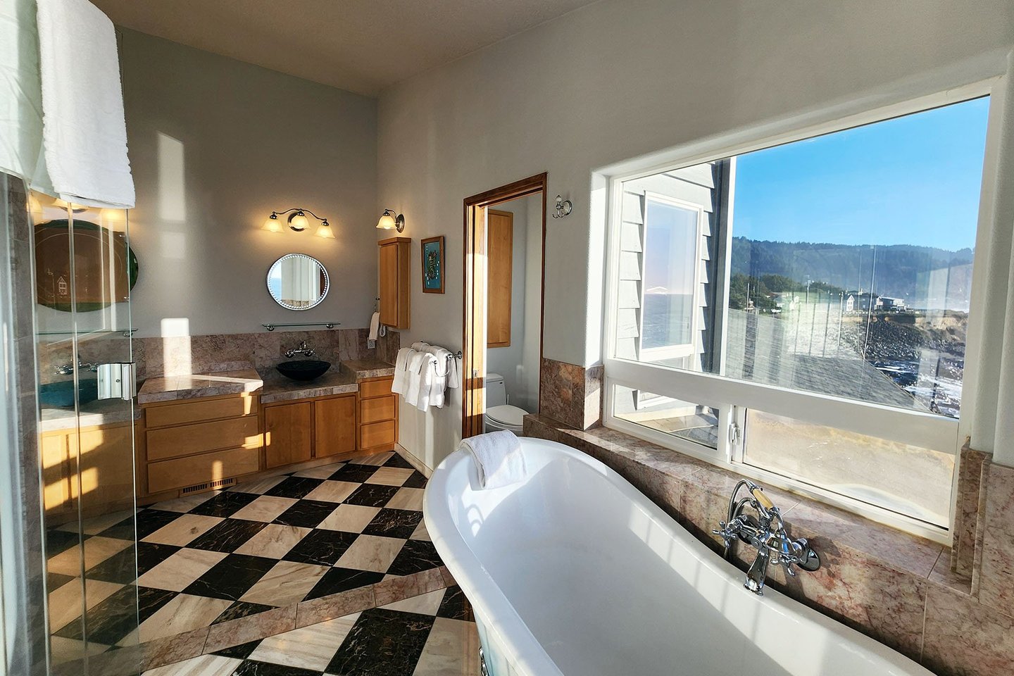 Large primary bedroom bath with separate walk in shower, clawfoot tub and spacious vanity!