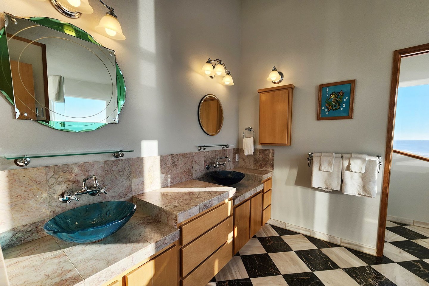 The primary bedroom ensuite bath with large 2 sink vanity.