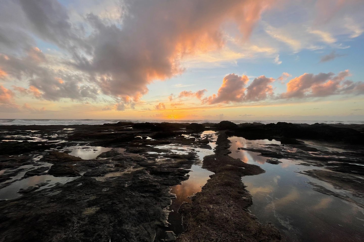 Capture the beauty of the sunset at low tide right below the house.