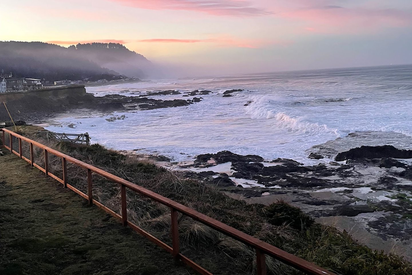 Fenced yard looks out over the famous Yachats basalt shoreline.